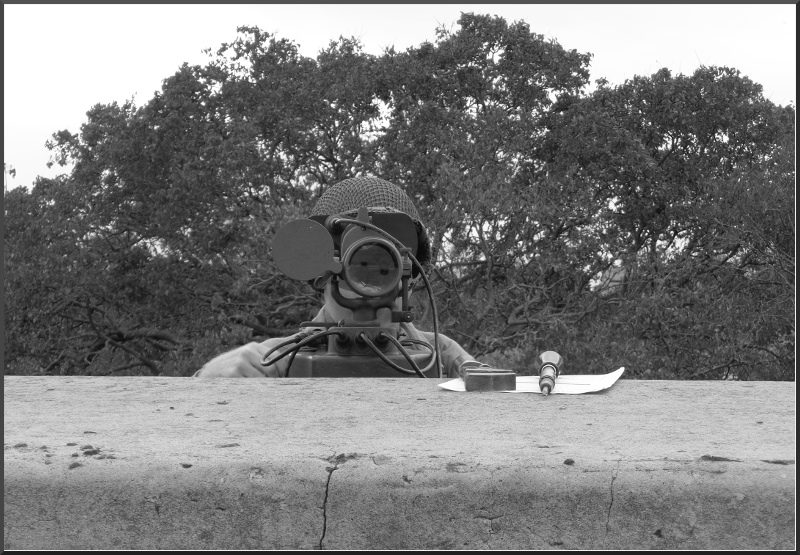 Modern photo of an AGFA member using an M1910A1 azimuth instrument